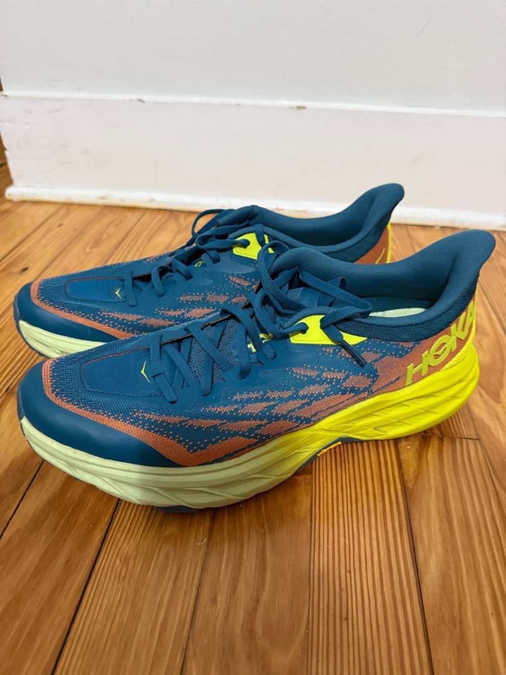 Hoka Teal Blue Running Shoes with Yellow and Orange Highlights